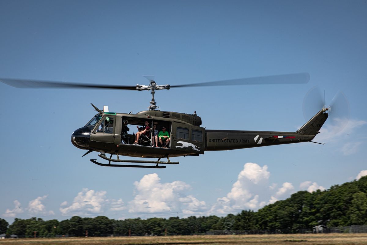 Experience the adrenaline rush of an open-door ride in a historic Huey helicopter at Grosse Ile Municipal Airport.